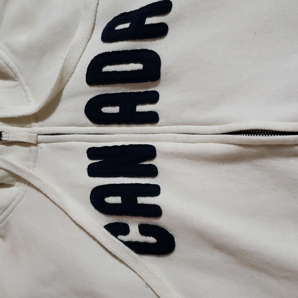 Attraction zip up jacket says Canada in front. Cream in color size lg - Picture 2 of 9